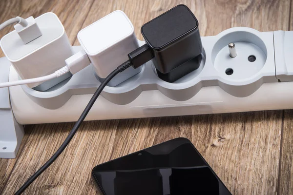 Smartphone Mobile Phone Chargers Connected Electrical Power Strip Various Devices —  Fotos de Stock