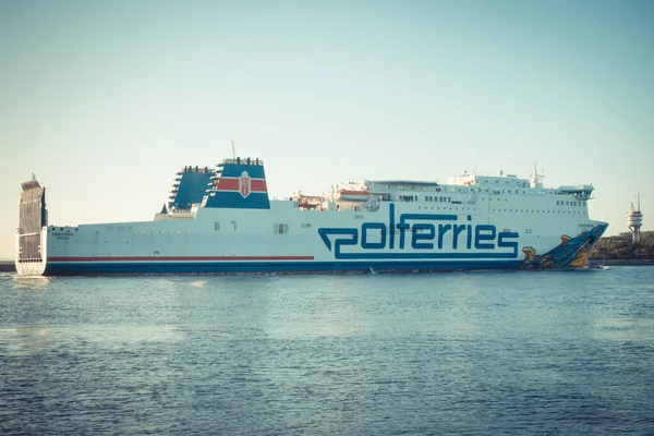 stock image Swinoujscie, West Pomeranian - Poland - June 14, 2021: View on Cracovia ferry entering to port of Swinoujscie at sunrise. Transport passengers and cars from Ystad