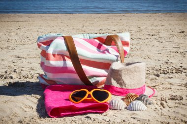 Accessories using for relax on sand at beach. Travel and vacation time concept