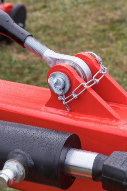 Screws, bolts and piston or actuator as part of agricultural machinery. Technology and engineering