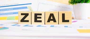 Tahta küplerle ilgili ZEAL kelimesi. Arka plan bir iş grafikleri. Finans kavramı