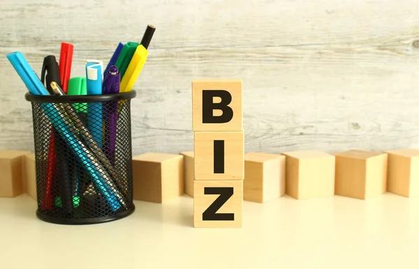 Stacked Wooden Cubes Letters Biz White Work Table Textured Gray — Foto Stock