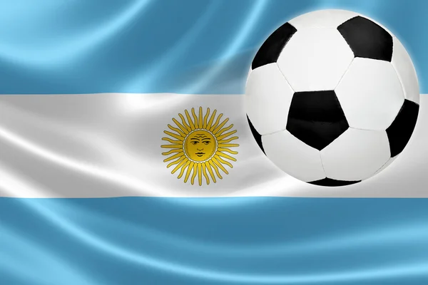 Ballon de football saute hors du drapeau argentin — Photo