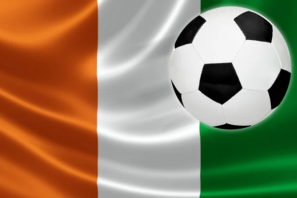 Soccer Ball Streaks Across Cote d 'Ivoire' s Flag — стоковое фото