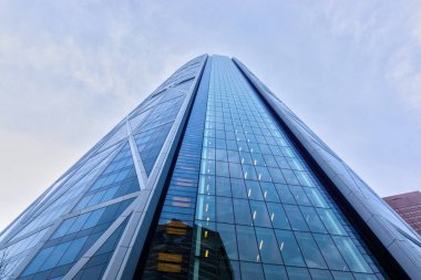 CALGARY, CANADA - NOVEMBER 13, 2021: Bottoms up view of the Bow Tower. At 774 ft tall, The Bow is one of the tallest skyscrapers in Calgary and Canada outside of Toronto.