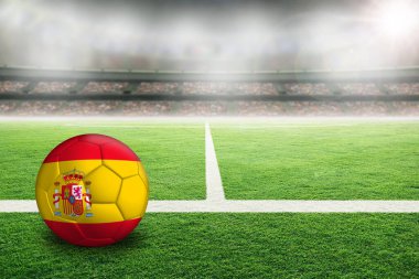 İspanya 'nın boyalı bayrağıyla aydınlık bir stadyumda futbol. Arkaplanda sığ alan derinliği olan ön plan ve futbol topuna odaklan ve boşluğu kopyala.