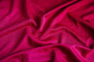 Parlak pembe, mor kumaş. Mor kıvrımlı bir madde parçası. Doku