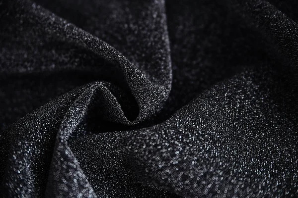 Pullu siyah kırışık kumaş. Sarılı kumaş. Parlak doku.