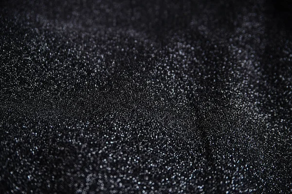 Pullu siyah kırışık kumaş. Sarılı kumaş. Parlak doku.