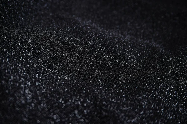 Pullu siyah kırışık kumaş. Sarılı kumaş. Parlak doku.