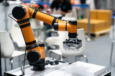 High-tech manufacturing process with robot programming arm in automation system