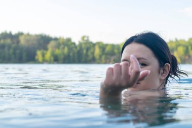 Portrait of a girl of Caucasian appearance in the lake.