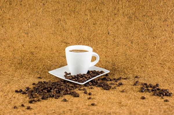 Κύπελλο του καφέ σε καφέ φόντο υφή — Φωτογραφία Αρχείου