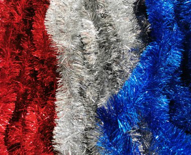 Kırmızı, beyaz ve mavi süsler. Fransız bayrağının tinsel renkleri