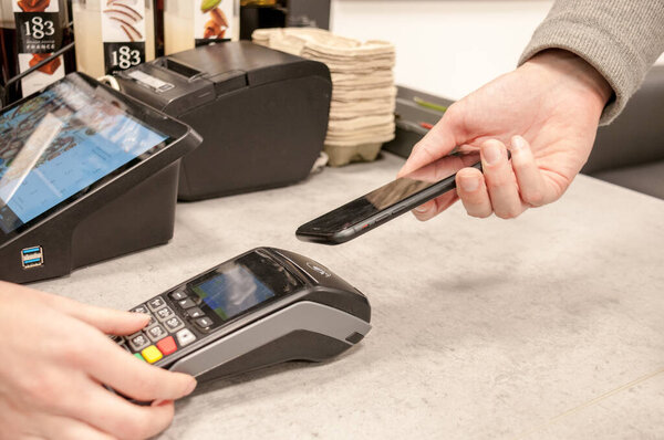 Payment by phone via the store's terminal