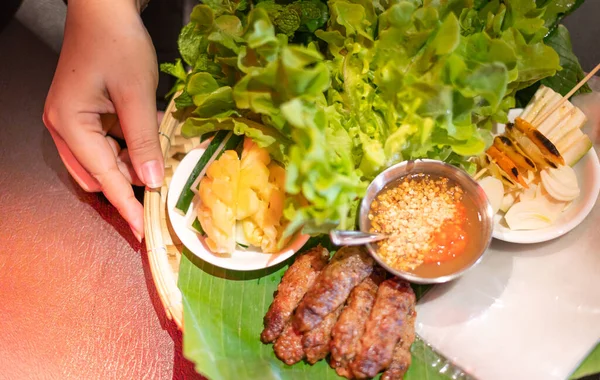 Female hand serving the set of Traditional food famous in Vietnam, The local Vietnam food that good for health.