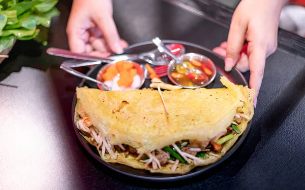 Female hand serving the set of Traditional food famous in Vietnam, The local Vietnam food that good for health.