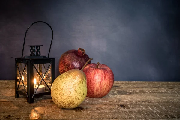 Pear Apple Pomegranate Illuminated Lantern Isolated Dark Background Healthy Eating — стоковое фото