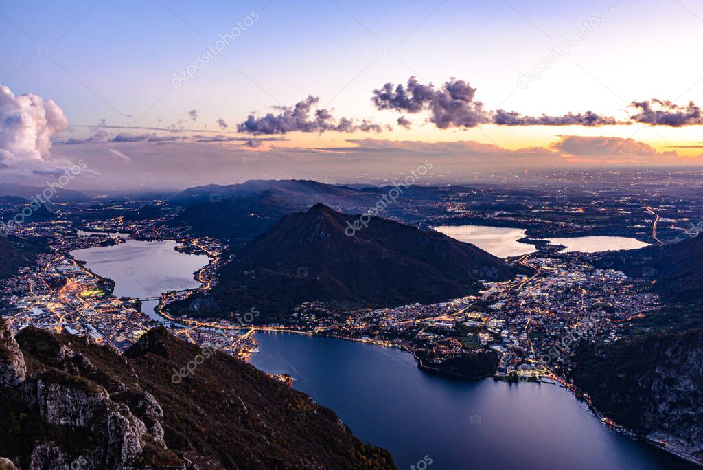 The city of Lecco, on Lake Como, photographed after sunset from Pian Dei Resinelli, with Brianza and its lakes in the background.