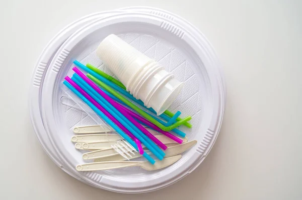 Plates Straws Knives Forks Glasses Disposable Plastic Objects Photographed Closely — Stock Fotó