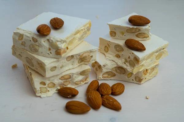 Pieces Hard Nougat Almonds Almonds Next Light Wooden Surface — Stock Fotó