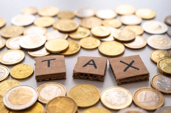 Coins Cardboard Squares Forming Word Tax Payment Taxes Tax Deadlines — ストック写真