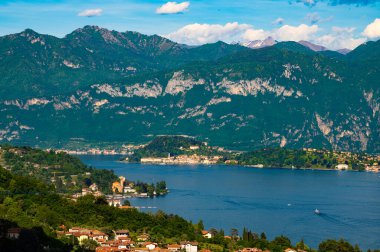 The panorama of Lake Como photographed from the town of Colonno, showing the Northern Grigna, the Southern Grigna, Bellagio, and the town of Colonno.