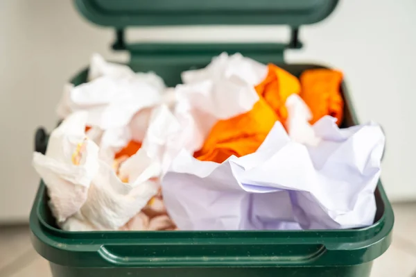 Recycle bin for recycling, containing paper to be recycled. Paper recycling and reuse. Sustainability and ecology.