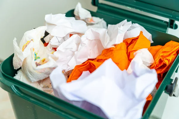 Recycle bin for recycling, containing paper to be recycled. Paper recycling and reuse. Sustainability and ecology.