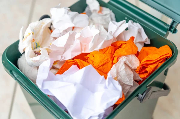 Recycle bin for recycling, containing paper to be recycled. Paper recycling and reuse. Sustainability and ecology.