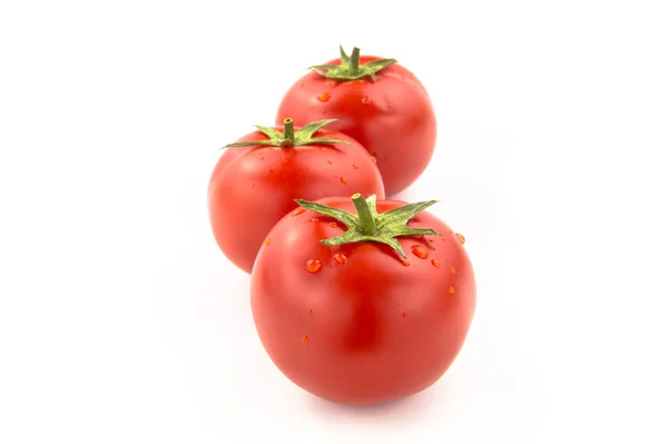 Três tomates arrancados com gotas de água — Fotografia de Stock