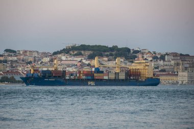 a transport carco freight Ship at the Rio Tejo in the City of Lisbon in Portugal.  Portugal, Lisbon, October, 2021