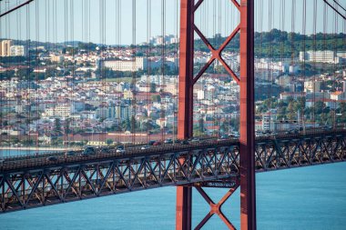 the Ponte 25 de Abril or 25the April Bridge at the Rio Tejo near the City of Lisbon in Portugal.  Portugal, Lisbon, October, 2021
