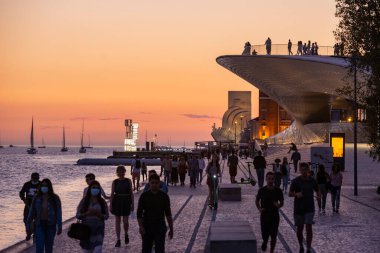 sunset at the promenade with the MAAT and the monument of Discoveries or Pedaro dos Descobrimentos in Belem near the City of Lisbon in Portugal.  Portugal, Lisbon, October, 2021