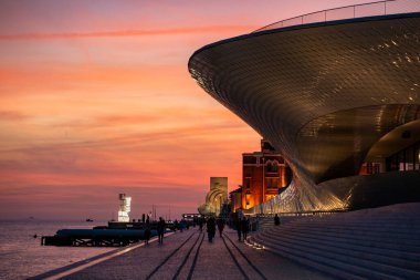 sunset at the promenade with the MAAT and the monument of Discoveries or Pedaro dos Descobrimentos in Belem near the City of Lisbon in Portugal.  Portugal, Lisbon, October, 2021