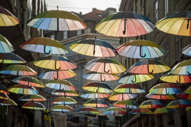 rainbow Umbrellas at the Party Street of Nova do Carvalho in Baixa in the City of Lisbon in Portugal.  Portugal, Lisbon, October, 2021