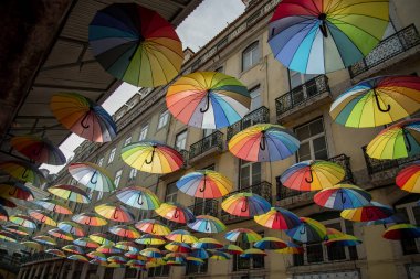 rainbow Umbrellas at the Party Street of Nova do Carvalho in Baixa in the City of Lisbon in Portugal.  Portugal, Lisbon, October, 2021