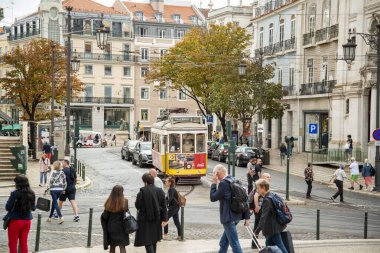 a traditional Lisbon Tram on the streets of Chiado in the City of Lisbon in Portugal.  Portugal, Lisbon, October, 2021