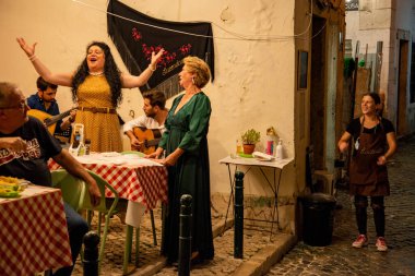 traditional Fado Music in a Fado Restaurant in the city area of Alfama in the City of Lisbon in Portugal. Portugal, Lisbon, October, 2021