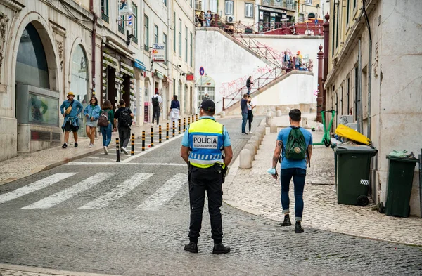 a police man at the Rossia Square in Baixa in the City of Lisbon in Portugal.  Portugal, Lisbon, October, 2021