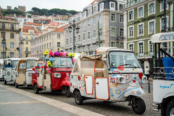 tuk tuk Taxis at the Parca de Figueira in Baixa in the City of Lisbon in Portugal.  Portugal, Lisbon, October, 2021