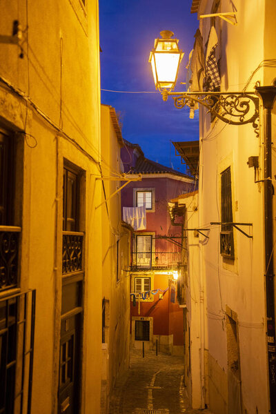 A street and alley in Alfama in the City of Lisbon in Portugal. Portugal, Lisbon, October, 2021