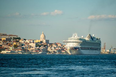 a Cruise Ship in front of the old Town of Alfama in Lisbon on the Rio Tejo near the City of Lisbon in Portugal.  Portugal, Lisbon, October, 2021