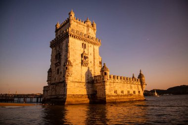 the Torre de Belem or Belem Tower at sunset on the Rio Tejo in Belem near the City of Lisbon in Portugal.  Portugal, Lisbon, October, 2021