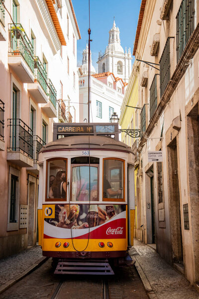 a traditional Lisbon Tram on the streets of alfama in the City of Lisbon in Portugal. Portugal, Lisbon, October, 2021