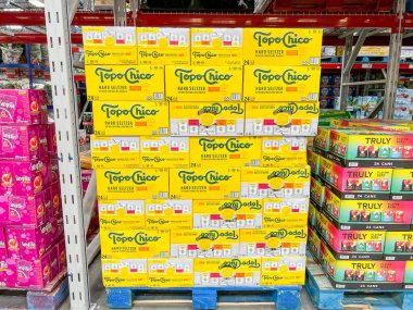 Orlando, FL USA - July 5, 2022:  Cases of cans of Topo Chico Flavored Hard Seltzer Spiked Sparkling drinks at a Sams Club grocery store waiting for customers to purchase.