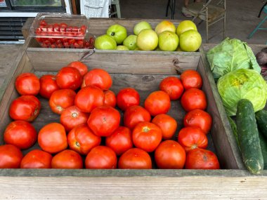 Bright red Florida tomatoes at a fruit and vegetable stand in Orlando, Florida.