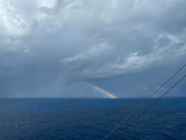 A view of a rainbow after a storm on the Caribbean Sea from a cruise ship.