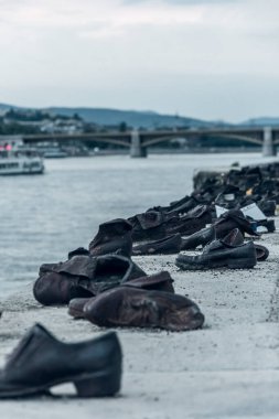 7 July 2022, Budapest, Hungary - Shoes on the Danube Bank, a memorial for the Jews killed during World War II in Budapest, Hungary