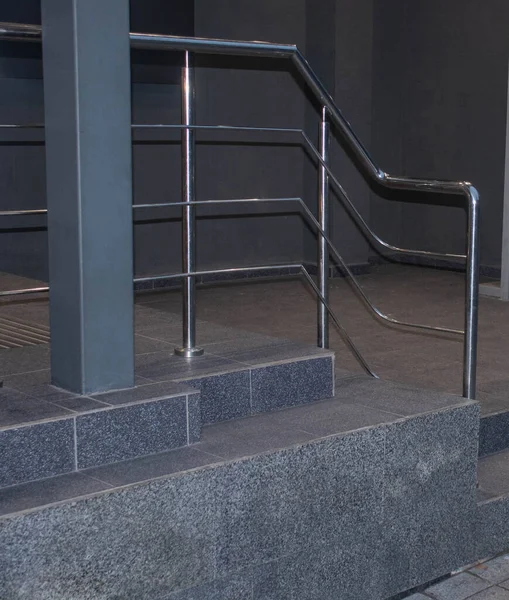 Stainless steel railings.Staircase step with stainless steel  handrail.